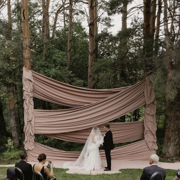 Fabric draping backdrop for a wedding ceremony