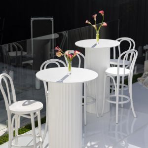 White bar tables and white bentwood bar stools